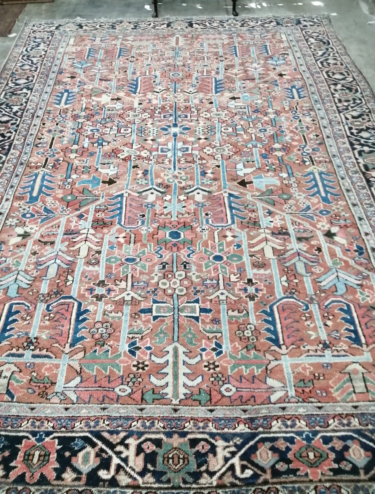 A Caucasian red ground carpet, 390 x 285cm